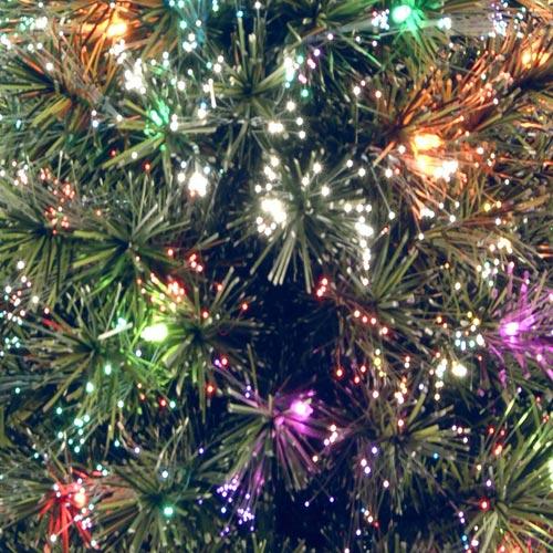 4 ft. fiber optic tree with a gold base and a star on top.