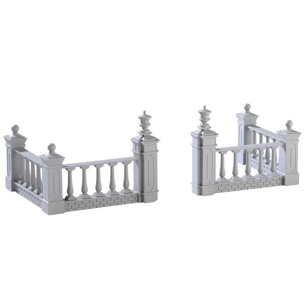 Lemax village accessories designed to look like a stone, regal fence. It comes in different pieces and you have to put them together so you can create the entrance at the fence. The bottom of the fence appears to be made of gray bricks.