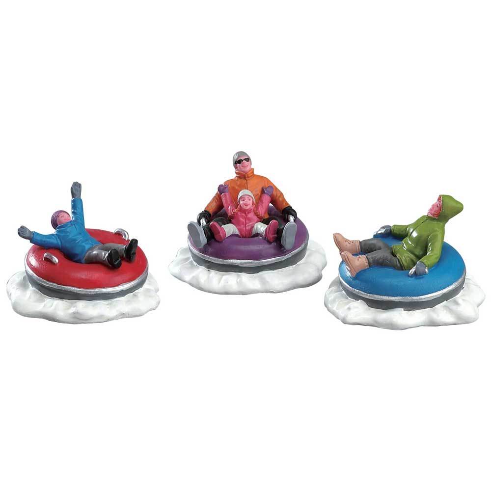 Village figurines for a Lemax display. Designed to look like four people in inner tubes, being used as sleds.