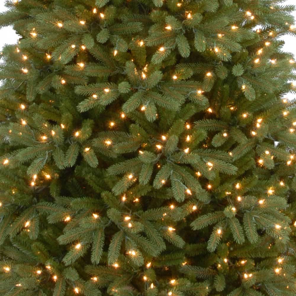 Artificial tree pre-lit with clear lights.