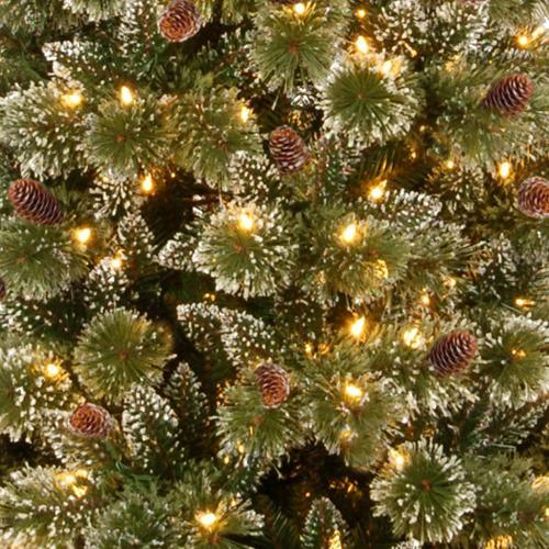 Artificial tree pre-lit with dual lights. Lights change from warm white to multi-colored. The branches are covered in white glitter.