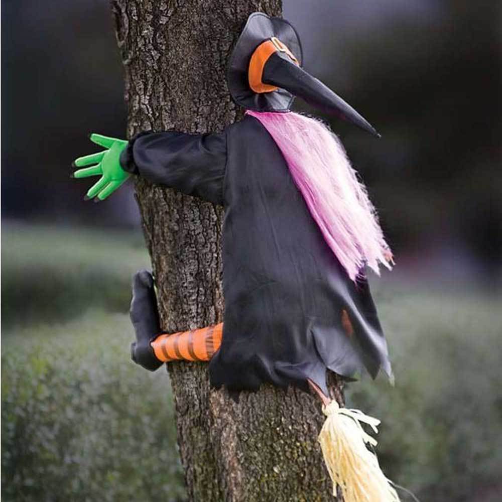 Decoration shaped like a witch who looks like she just crashed into a tree.