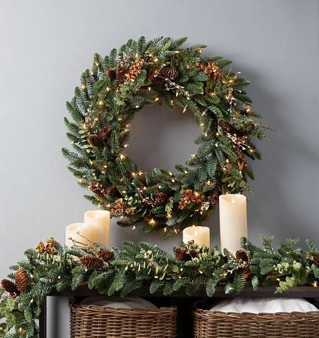 Christmas wreath with pine cones and berries