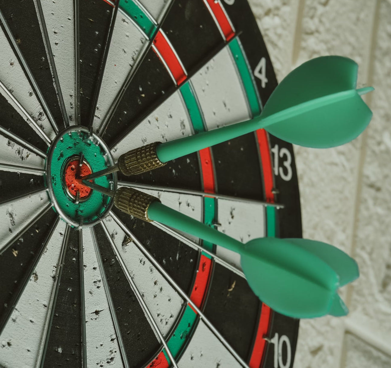 Dartboard with dart in center