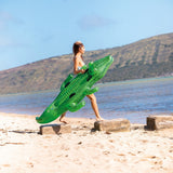 Pool inflatable shaped like an alligator.