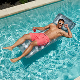 Silver inflatable pool mattress.