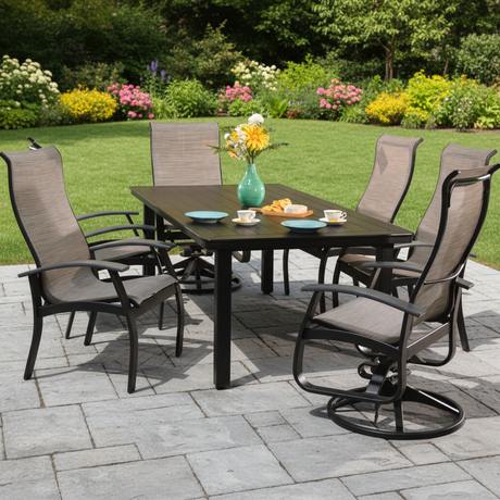 This is a lifestyle image showing this patio dining set on a stone patio in a nice, grassy backyard.