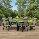 This is a lifestyle image showing this sling patio dining set on a wooden porch surrounded by plants in a nice backyard.