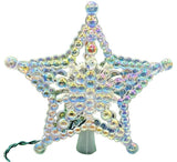 This image shows how iridescent the beaded tree star is on a white background.