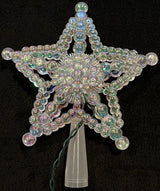 This image shows what the iridescent tree star looks like on a black background.