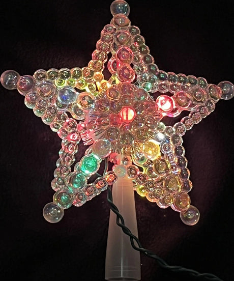 This image shows the iridescent beaded tree star with multi-colored lights.