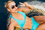 Clear inflatable inner tube with glitter inside. This tube has gold glitter.