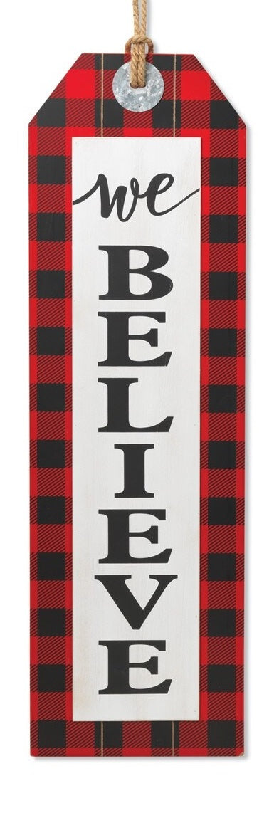 Wall hanging sign shaped like a gift tag. This one reads "We Believe" and has a red and black buffalo check border.