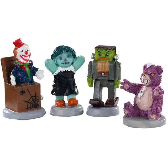 Polyresin figurines for a Lemax Spooky Town village display. Designed to look like four spooky toys. One is a Jack-in-the-Box with a smiling clown inside and a spider web with a spider on the front of the box. One is a teal doll. One is a robotic Frankenstein. And the last one is an angry, purple teddy bear.