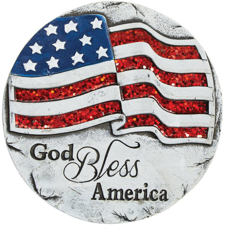 Outdoor stepping stone decorated patriotically. It reads "GOD BLESS AMERICA" and features a glittered red, white and blue flag.
