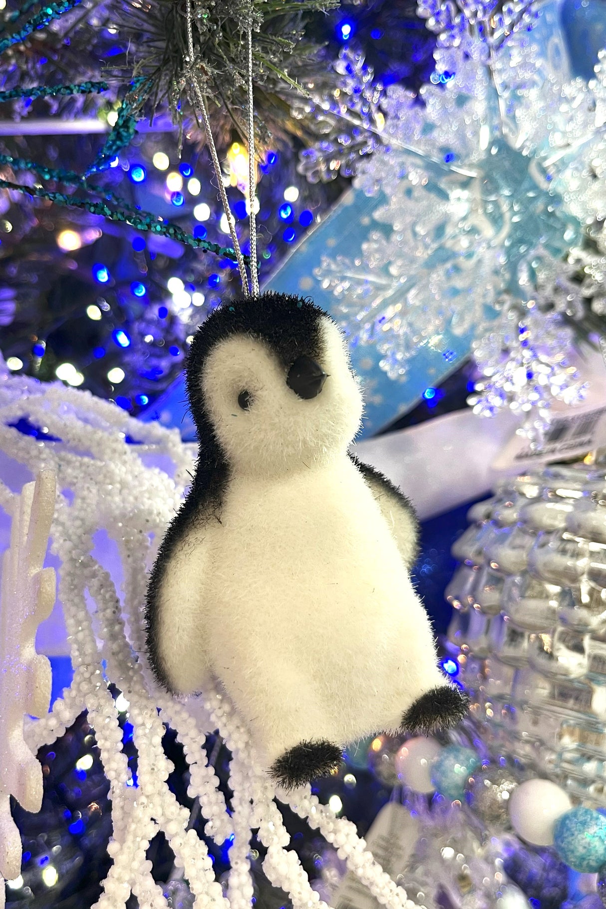 Soft ornaments shaped like penguins.