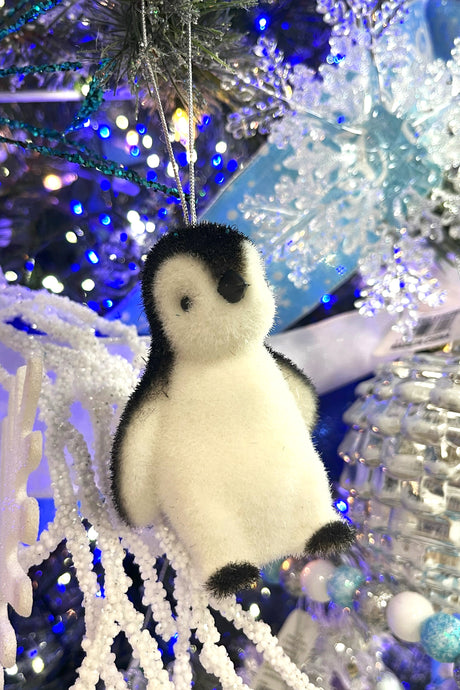 Soft ornaments shaped like penguins.
