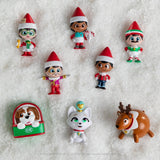 This image shows the 8 different Elf on the Shelf mini options on a faux snow backdrop.