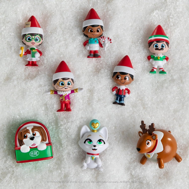 This image shows the 8 different Elf on the Shelf mini options on a faux snow backdrop.