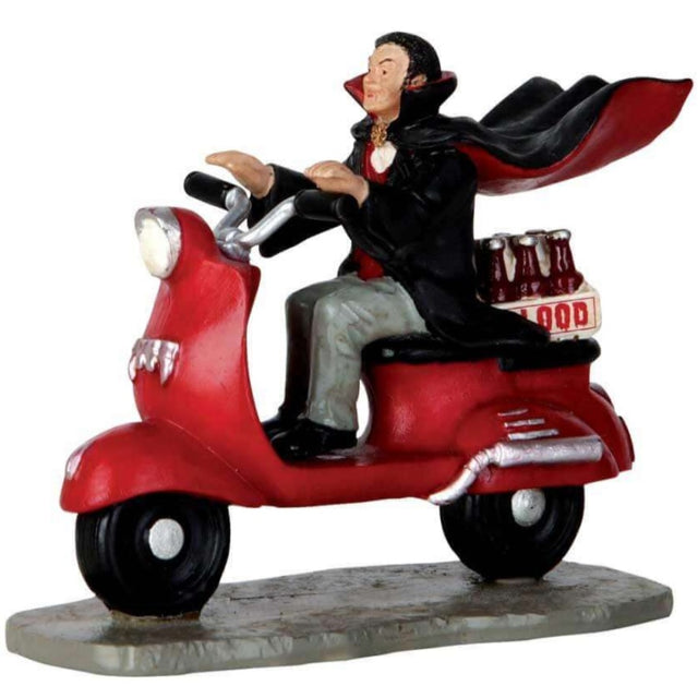 Polyresin figurine for a Lemax display. Designed to look like a vampire riding a moped. There are bottles of blood in the backseat of the moped.