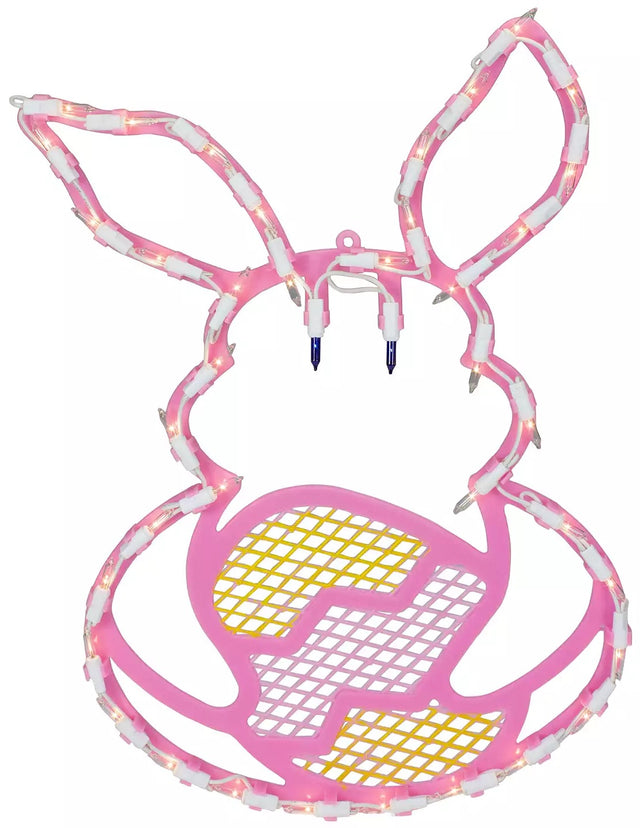 A pink window silhouette decoration shaped like a bunny holding a yellow egg on a white background
