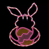 A pink window silhouette decoration shaped like a bunny holding a yellow egg on a black background