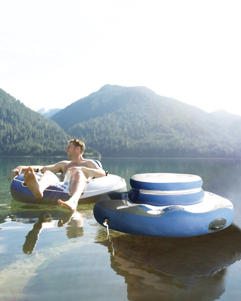 Blue and white inflatable cooler with cupholders.