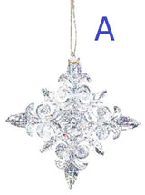 Ornaments shaped like glitter covered snowflakes.