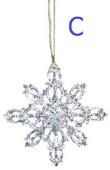 Ornaments shaped like glitter covered snowflakes.