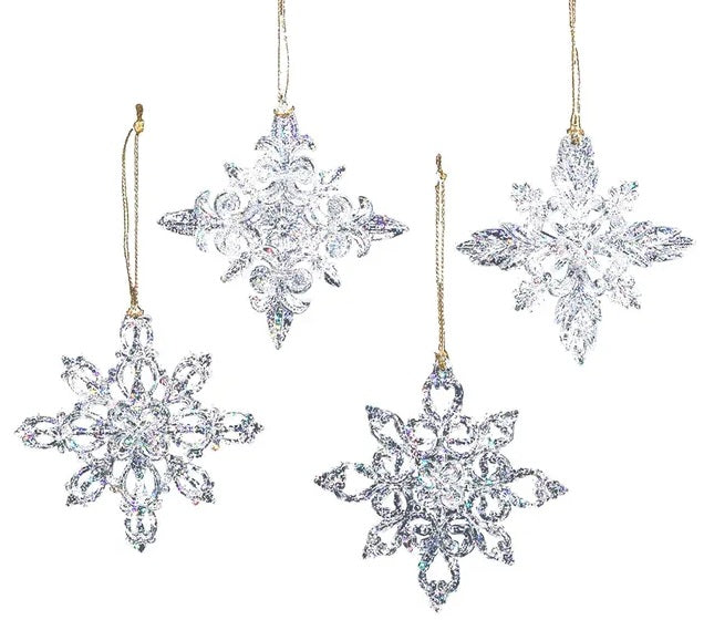 Ornaments shaped like glitter covered snowflakes.