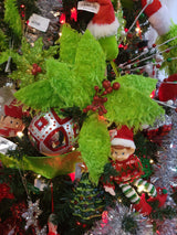 Furry lime green poinsettia-shaped flower pick with red glitter in the center.