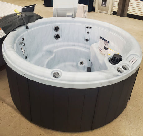Clearance display of a round Nordic hot tub at our Tinley Park Outlet store.