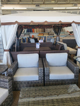 Clearance outdoor patio furniture set with chairs and table on display in the Tinley Park Outlet store.