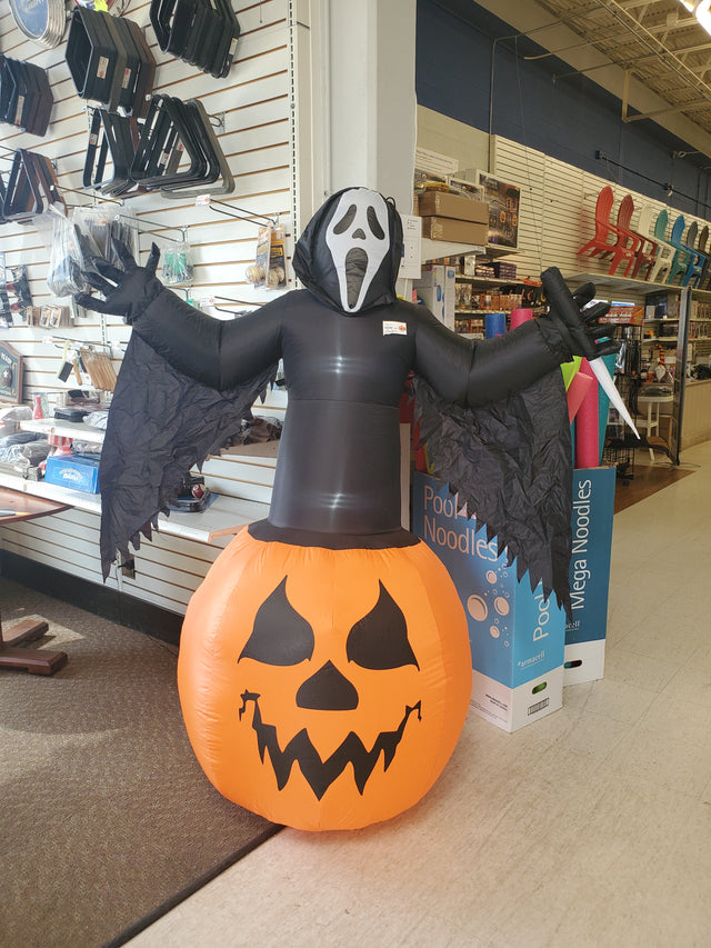 Halloween inflatable scream face on a pumpkin decoration at the Tinley Park Outlet store.
