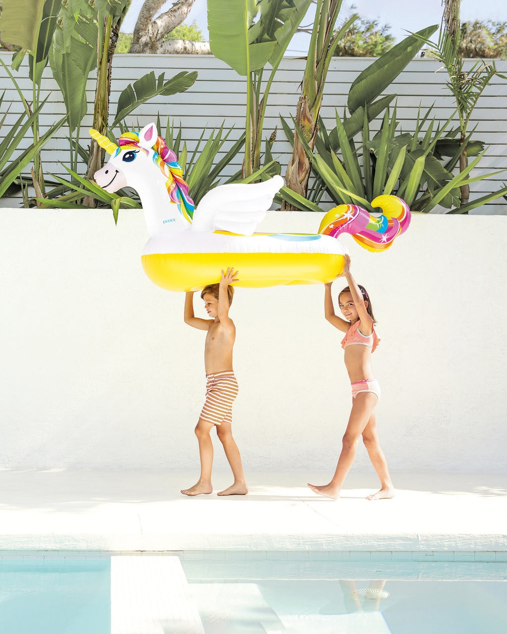 Inflatable pool float shaped like a rainbow unicorn.