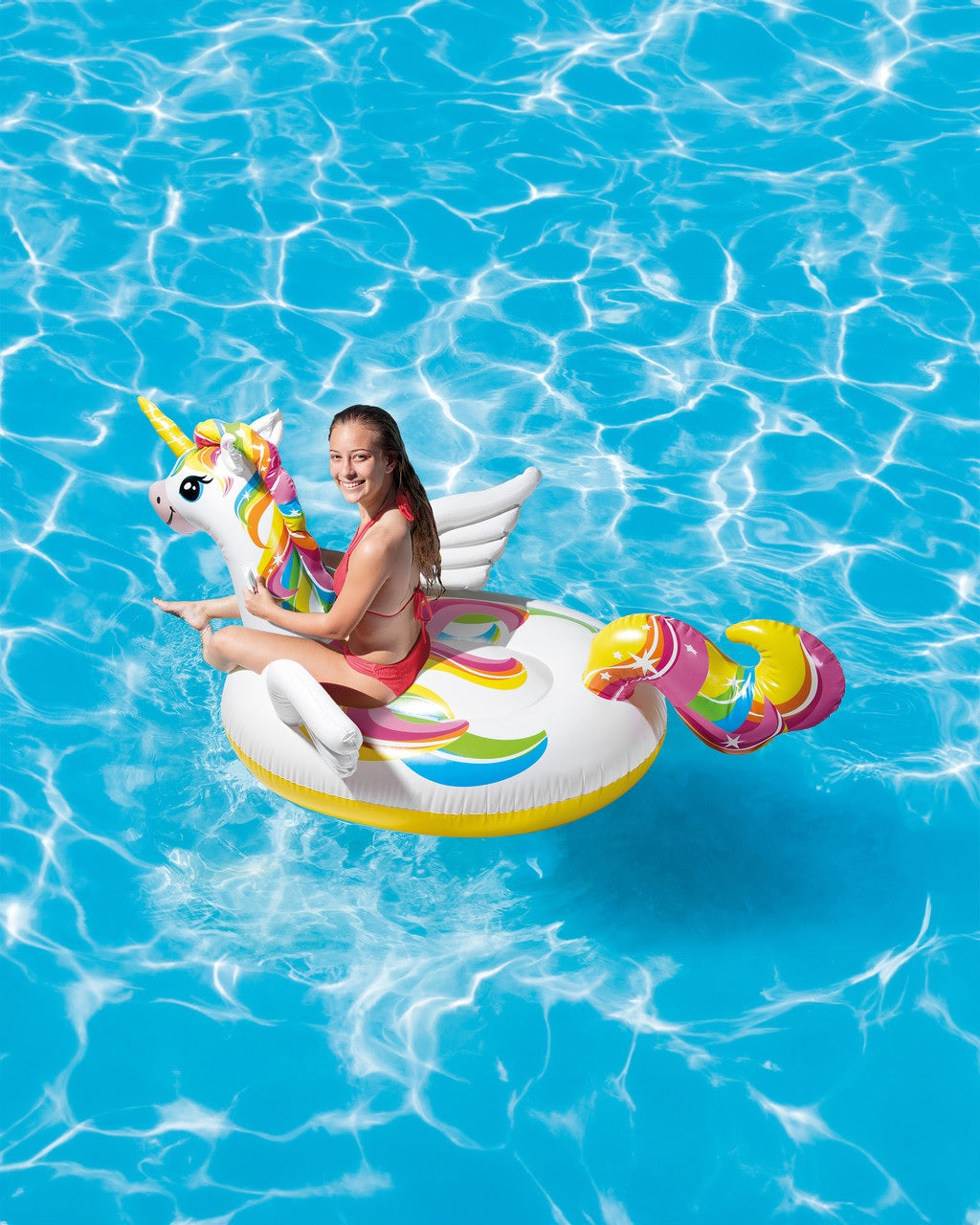 Inflatable pool float shaped like a rainbow unicorn.