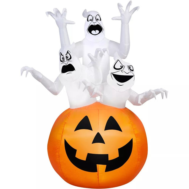 Halloween inflatable shaped like three spooky ghosts jumping out of a large jack-o-lantern.