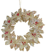Gold glitter ornament shaped like a wreath with red berry accents.
