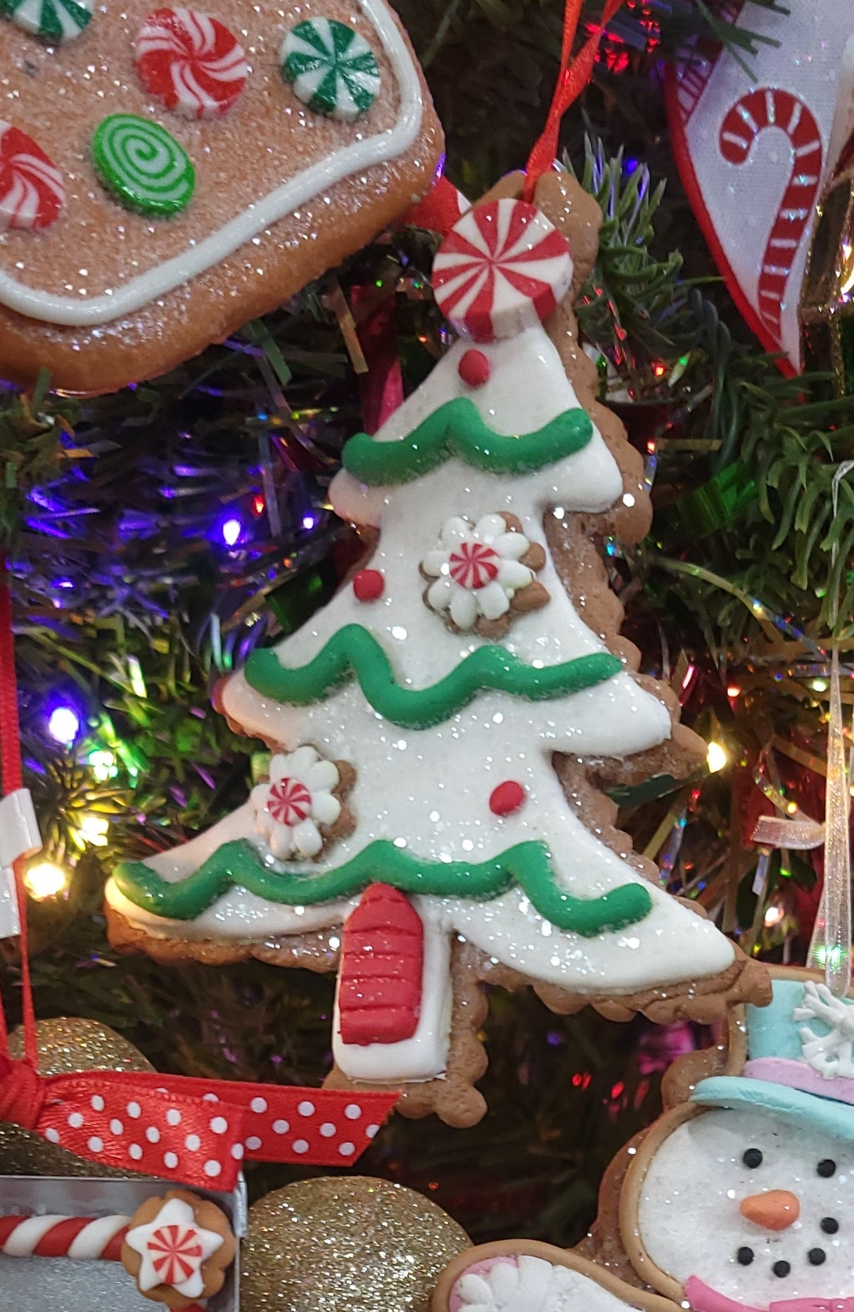 Ornaments shaped like decorated Christmas cookies.