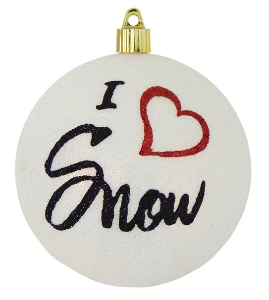 White glittered ornament that reads "I love Snow" in black cursive font. The word "love" is represented by a red glitter heart.
