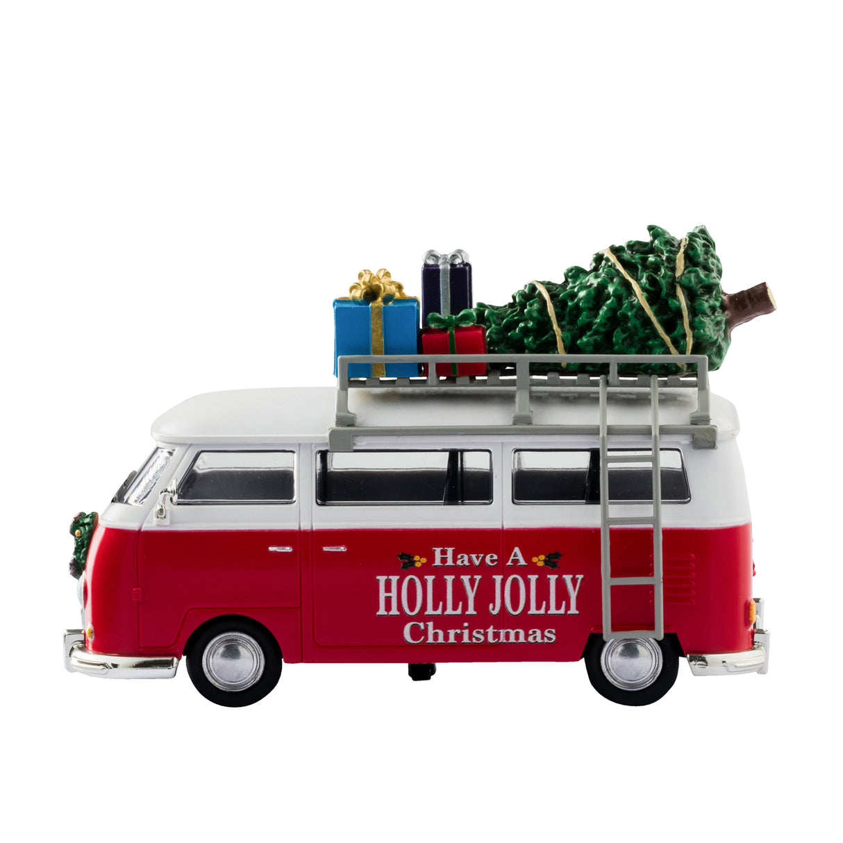 Plastic table accent for a Lemax display. Designed to look like a red and white Volkswagen bus. The sides read "Have a Holly Jolly Christmas" and features little holly leaves and berries. There's a decorated wreath on the front bumper. There's a ladder on the side that leads up to the roof of the van where there's a collection of presents and a Christmas tree.