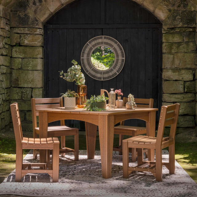 This is a lifestyle image showing the Antique Mahogany colored square table surrounded by matching chairs. 