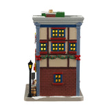 Porcelain lighted building for a Lemax display. Designed to look like two, colorful shops in the West Side Market. The shop on the left is Bob's Sausage Shoppe & Butcher. There's a wreath on the door and you can see the meat hanging inside. There's a sign on the ground that reads "SALE BOGO." The shop on the right is called Bennet the Fishmonger. You can see all the fish inside.