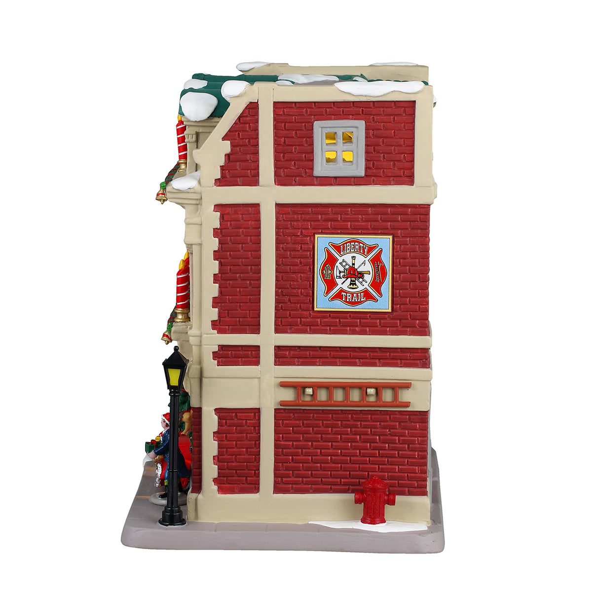 Porcelain lighted building for a Lemax display. Designed to look like a red brick fire house. There are large red and white striped candle accents, decorated wreaths and a Christmas tree. You can see the red firetruck in the garage and there's a lamppost next to the front door. There's snow on the roof and on the sidewalk.