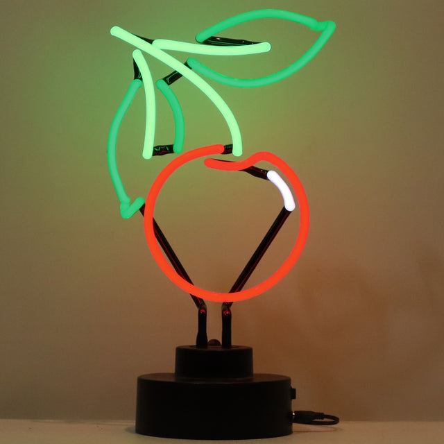 This neon sculpture is shaped like a red cherry with a green stem and two green leaves.
