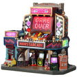 This image shows what this Lemax Spooky Town lighted building looks like on a white background. It was designed to look like an arcade made out of an arcade game cabinet. It has lots of bright graphics. There's a big sign that reads "GAME OVER." There are large buttons and a joystick over another sign that reads "MONSTARCADE."