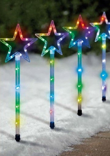 Pathway markers shaped like stars that are pre-lit with LED lights that can be controlled by an app.