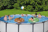 This image shows a pool with four adults playing with a beach ball, two kids chatting and two kids floating in inner tubes.
