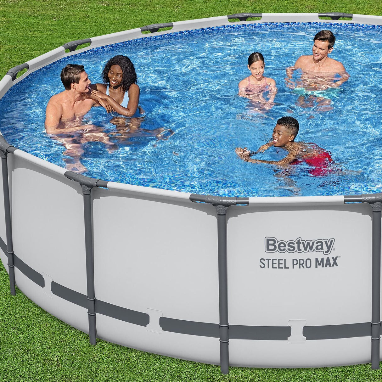 This is a lifestyle image showing five people (3 adults and two young kids) swimming in this Bestway Steel Pro MAX pool in a grassy backyard.