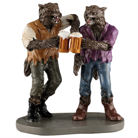 This image shows what this Lemax Spooky Town figurine looks like on a white background. It was designed to look like two werewolf buddies clinking their mugs of beer together in celebration. The werewolf on the left is wearing a dirty white shirt with a brown, tattered vest along with gray jeans with holes in them and black cowboy boots. The werewolf on the right is wearing a purple jacket, tattered blue jeans and brown cowboy boots.